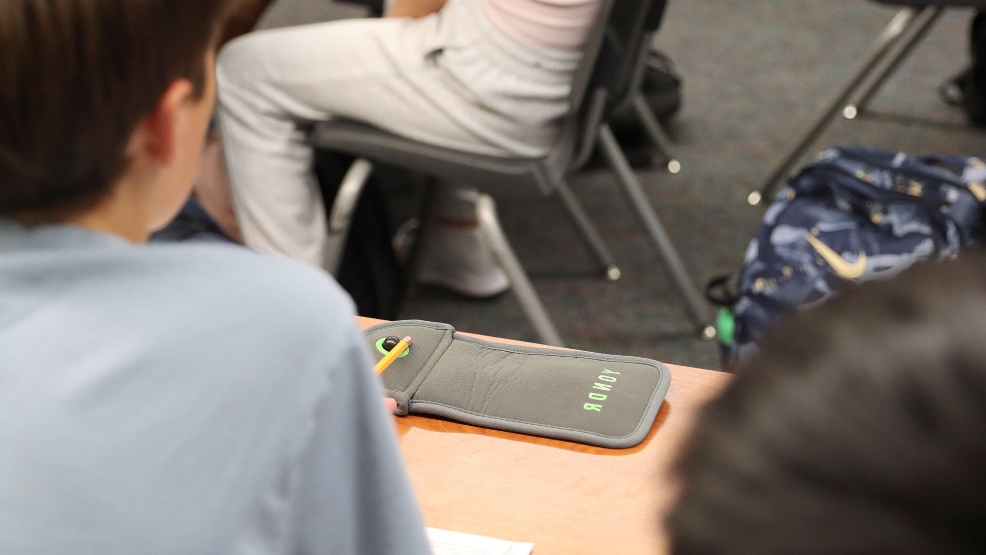 cell phone pouch in a classroom